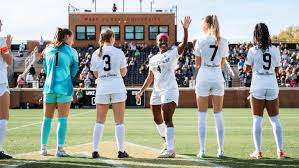 Nikayla Small with her team during training